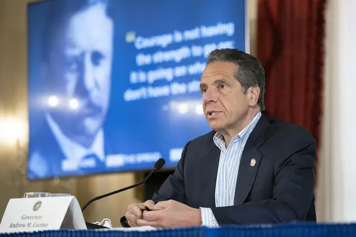Governor Andrew Cuomo sits in the Executive Mansion in Albany for a press briefing.